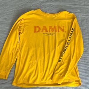 Large yellow TDE shirt